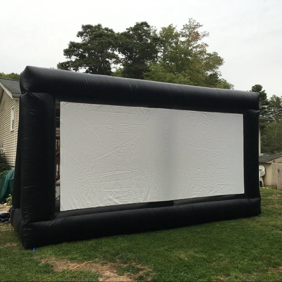 Outdoor movie night setup with screen and speakers