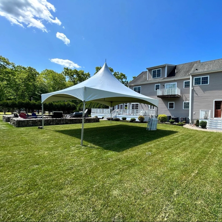20x20 white frame tent on a backyard lawn